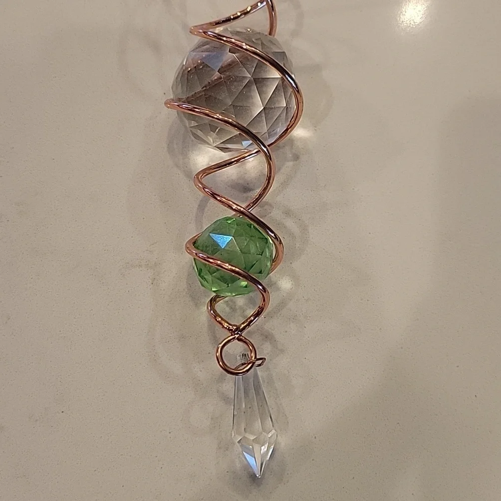 Elegant Copper Spiral Ornament with Crystal Accents